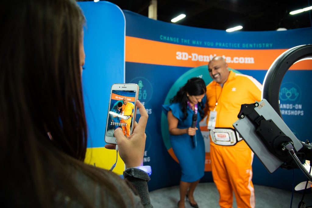 Dr. Mona Patel with T-Bone at Dentsply Sirona World 2019 in Las Vegas.