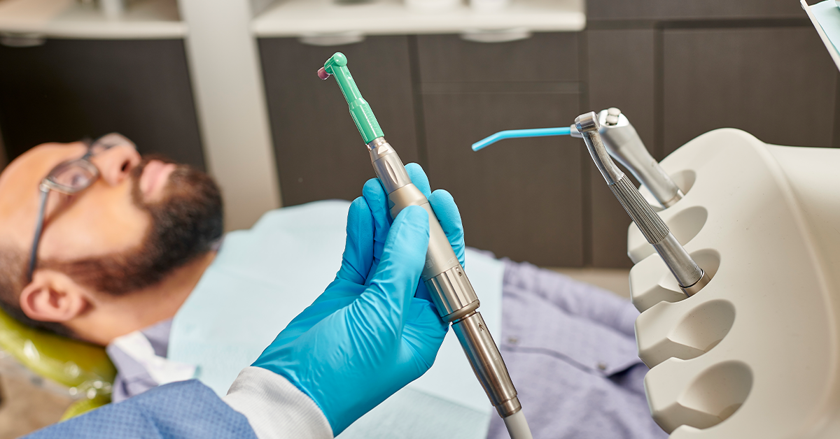 Dental handpiece in use on a patient.