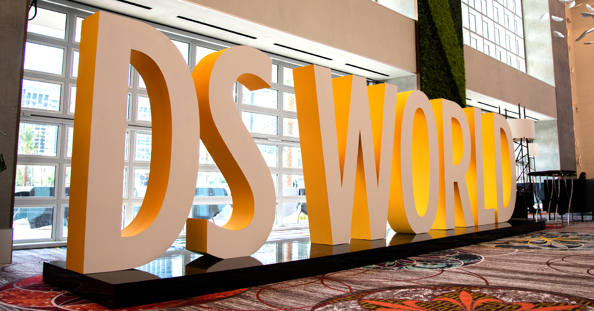 Photo of large block letters that reads "DS WORLD" taken at the 2021 Dentsply Sirona World trade show in Las Vegas.