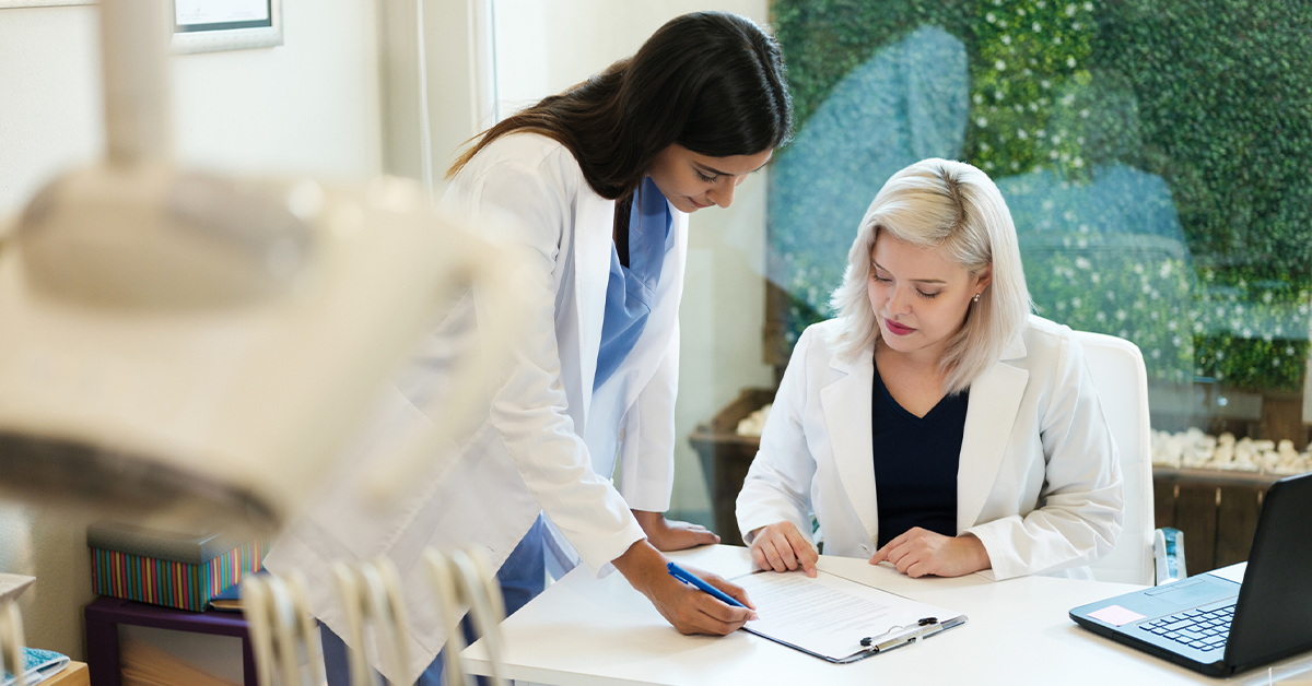 Stock photo of a dentist with her dental assistant