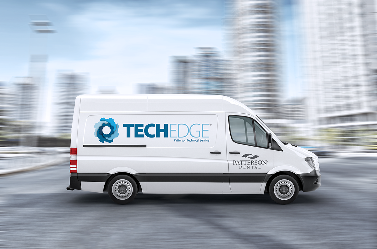 A white Patterson Dental TechEdge service van is shown in motion on a city street. The side of the van displays the blue TechEdge logo and the text "TECHEDGE Patterson Technical Service," along with the Patterson Dental logo near the front door. The background features blurred modern high-rise buildings, emphasizing speed, mobility, and on-site technical support.